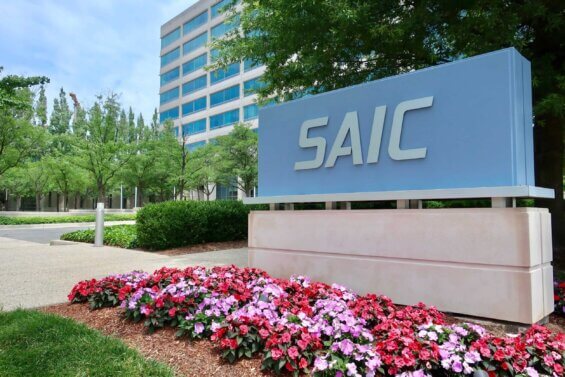 A sign reads "SAIC" at the entrance of the company's headquarters in Reston, Virginia.