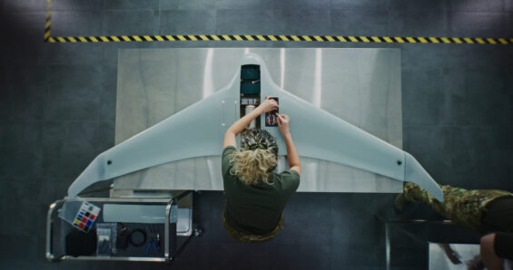 A top-down view of an engineer working on a drone
