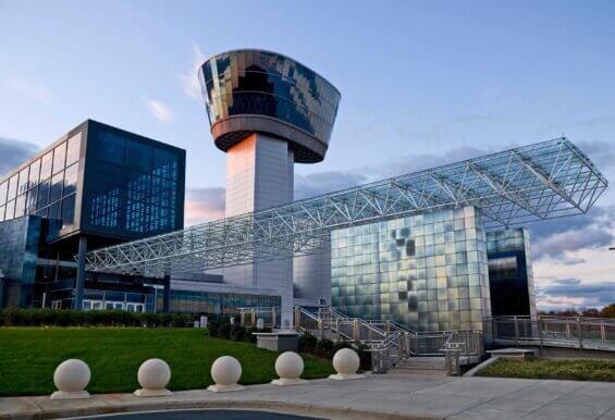 The exterior of the Udvar-Hazy Center in Chantilly, Virginia at sunset.