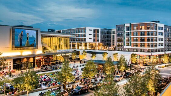 A brightly lit courtyard at dusk in the Mosaic District in Fairfax, Virginia.