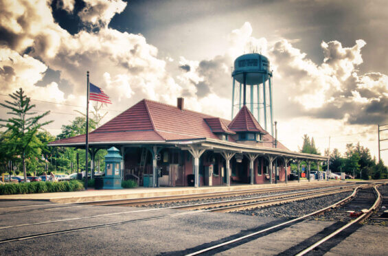 A train stop on a cloudy day.